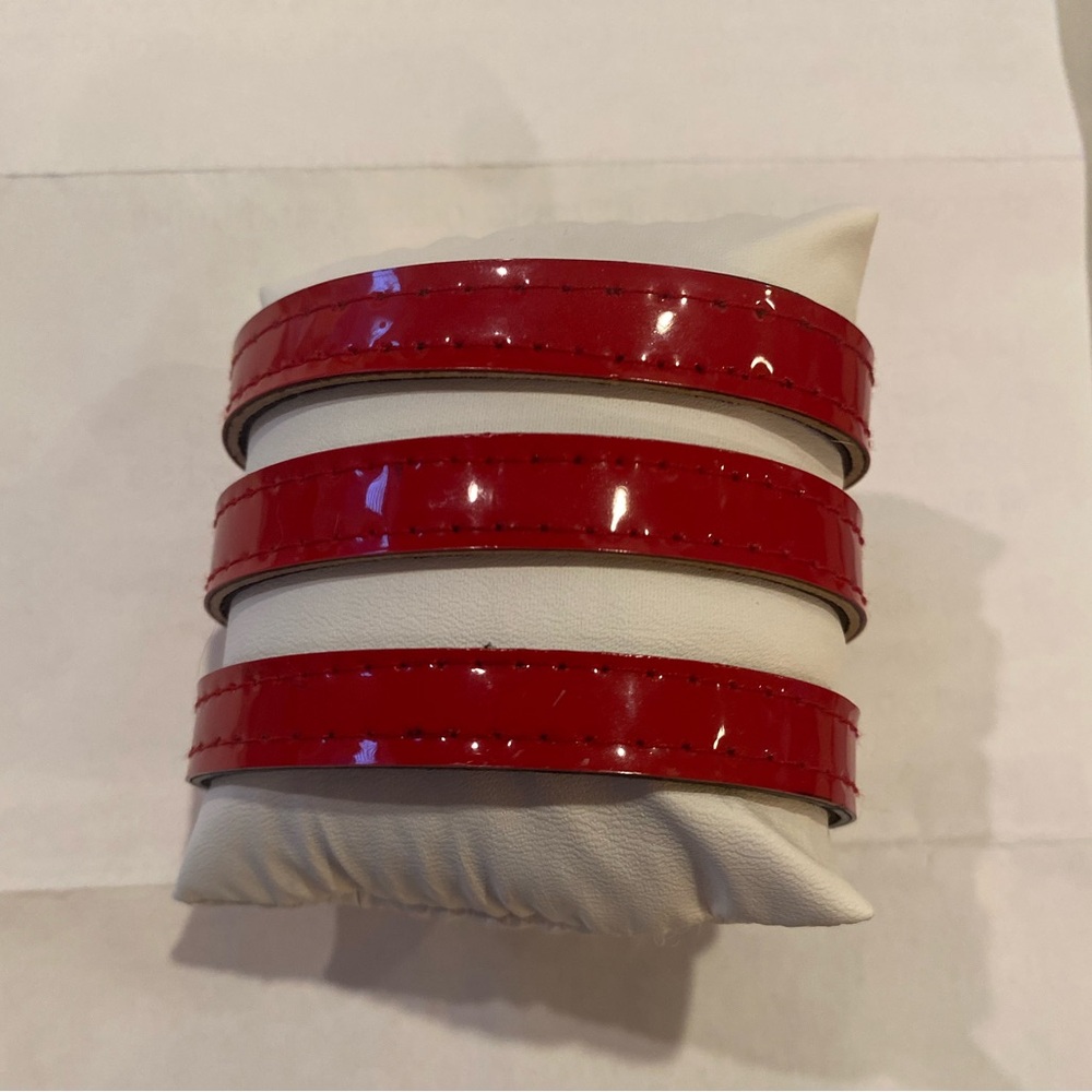 Triple wrap red patent vinyl bracelet with adjustable snaps